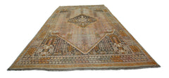 A vintage Persian Shiraz rug featuring a central diamond medallion and intricate geometric patterns.