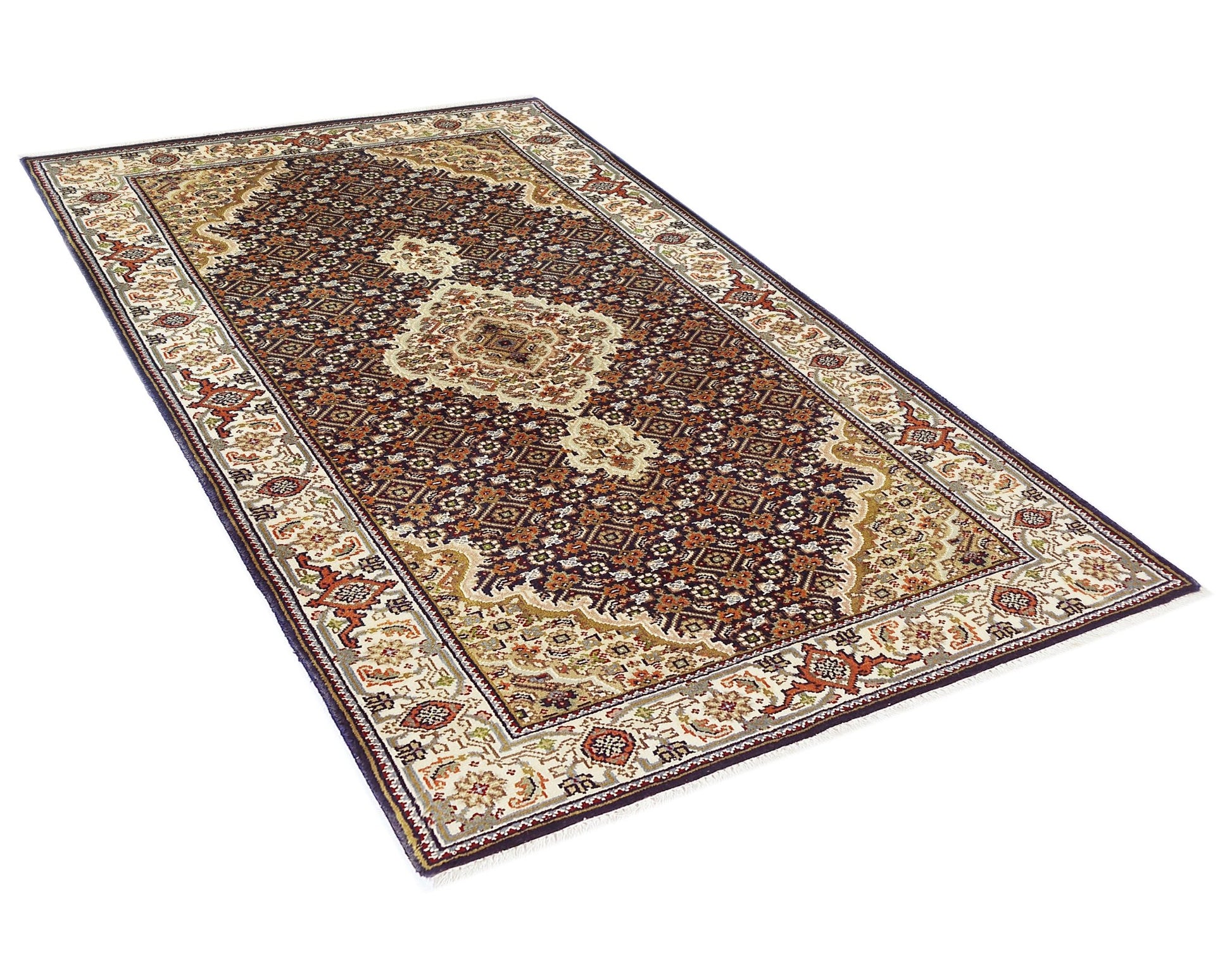 A rectangular vintage Persian silk Tabriz rug featuring an intricate floral pattern in deep red and cream.