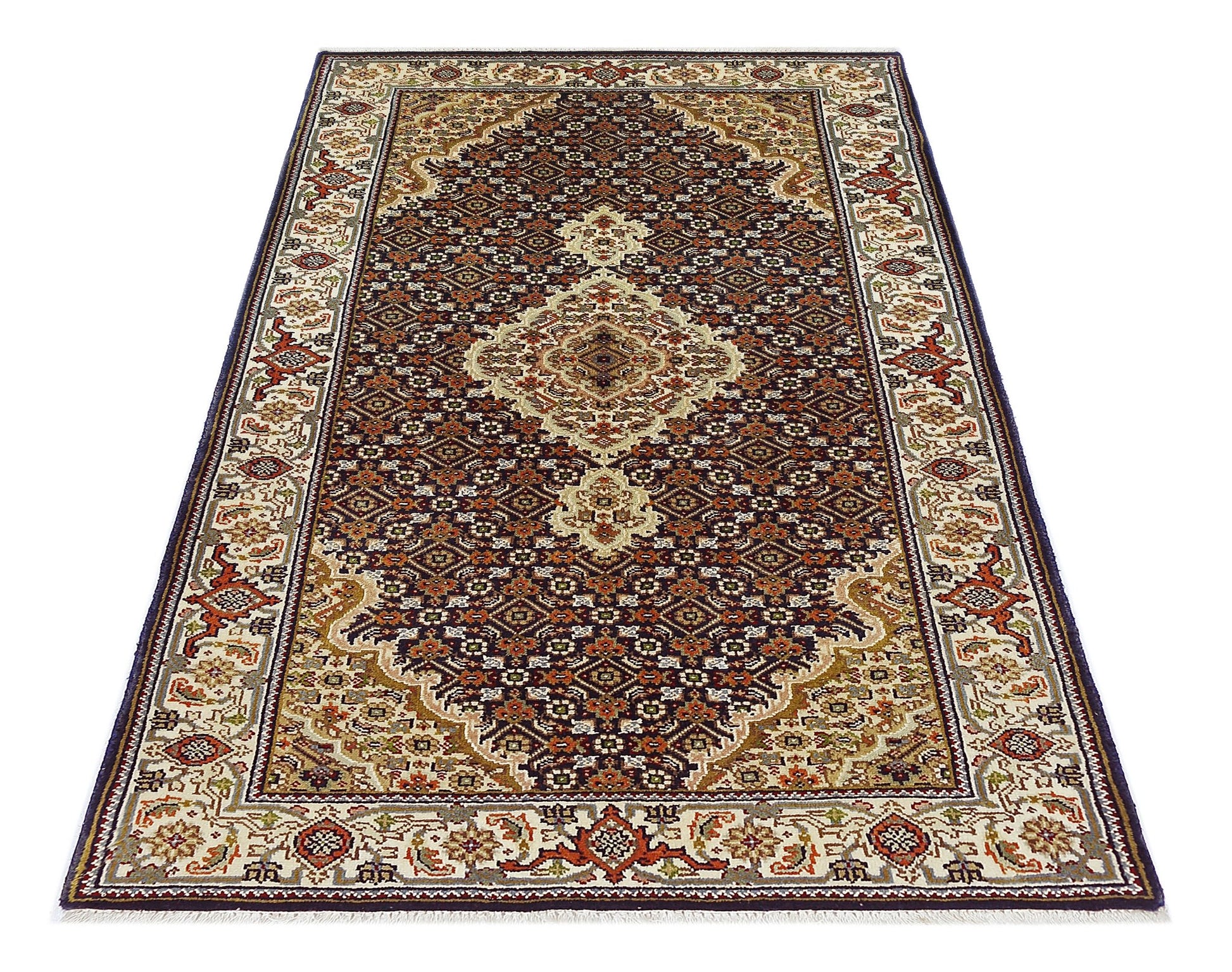 A vintage Persian Tabriz rug featuring an intricate floral medallion pattern in deep red and cream.