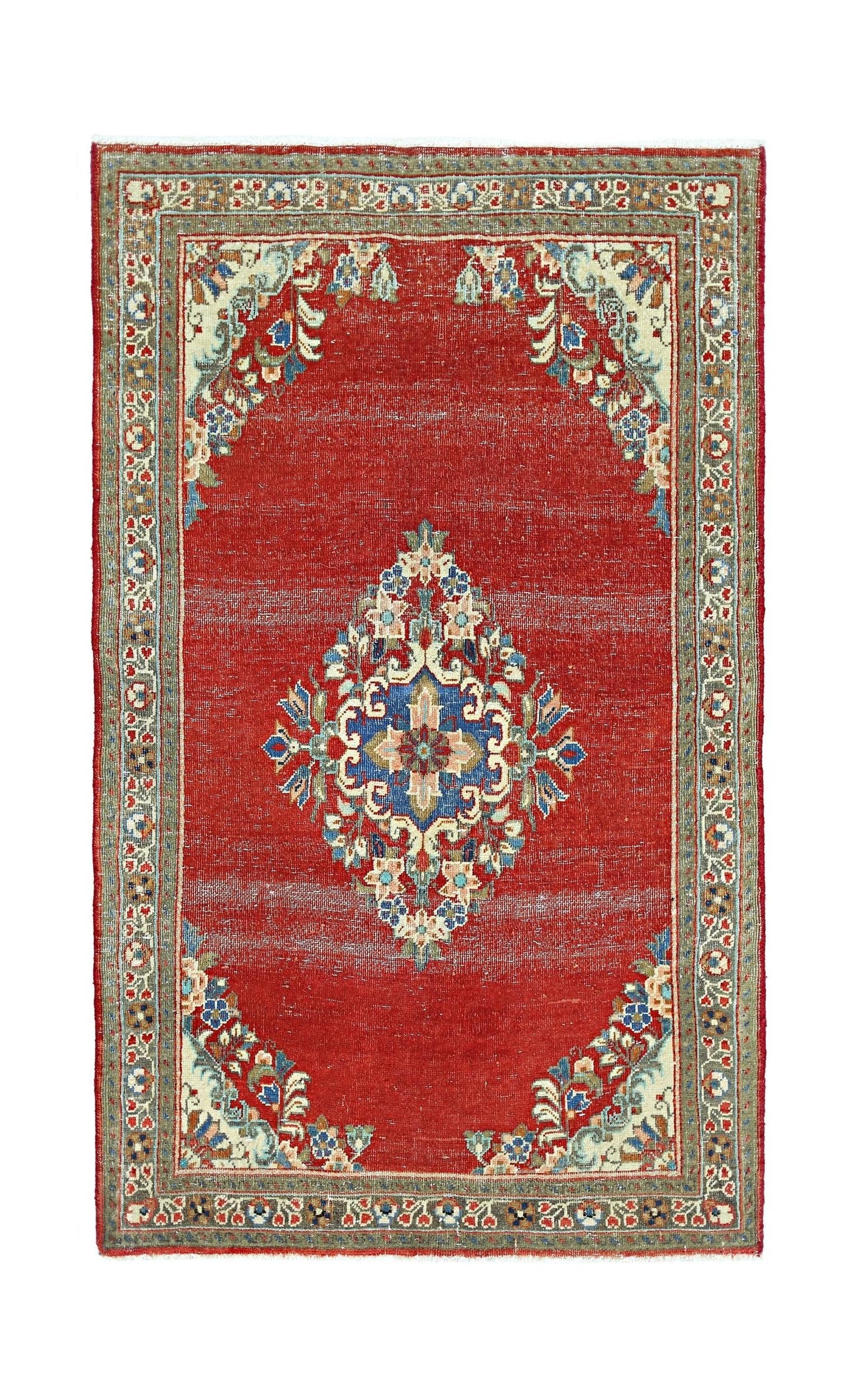 A vintage Persian Tabriz rug featuring a central floral medallion on a red field with ornate borders.