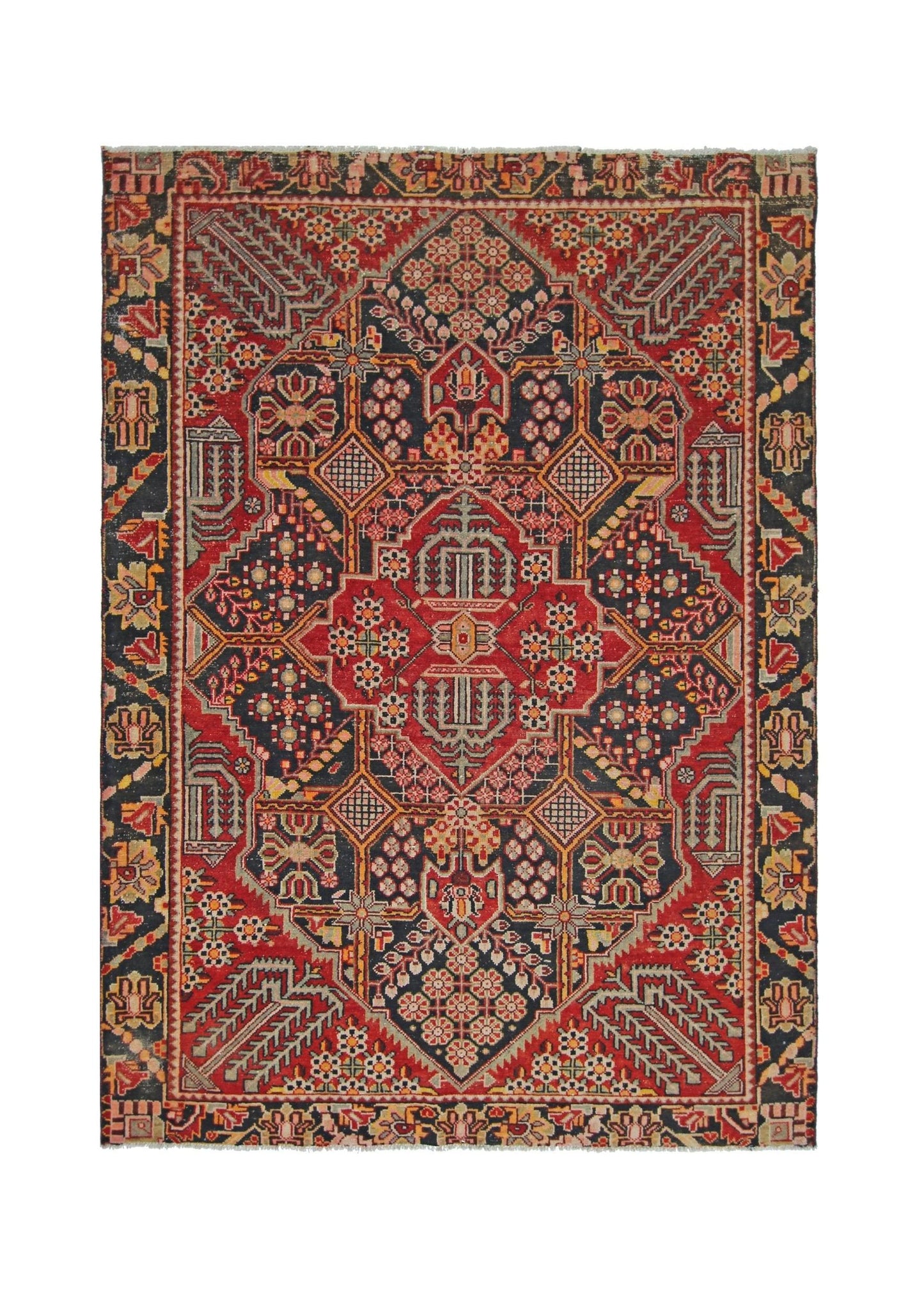 A vintage Persian Tabriz rug featuring a geometric floral pattern in red, navy, and cream tones.