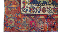 A vintage Persian Tabriz rug featuring intricate geometric and floral patterns in rich colors.