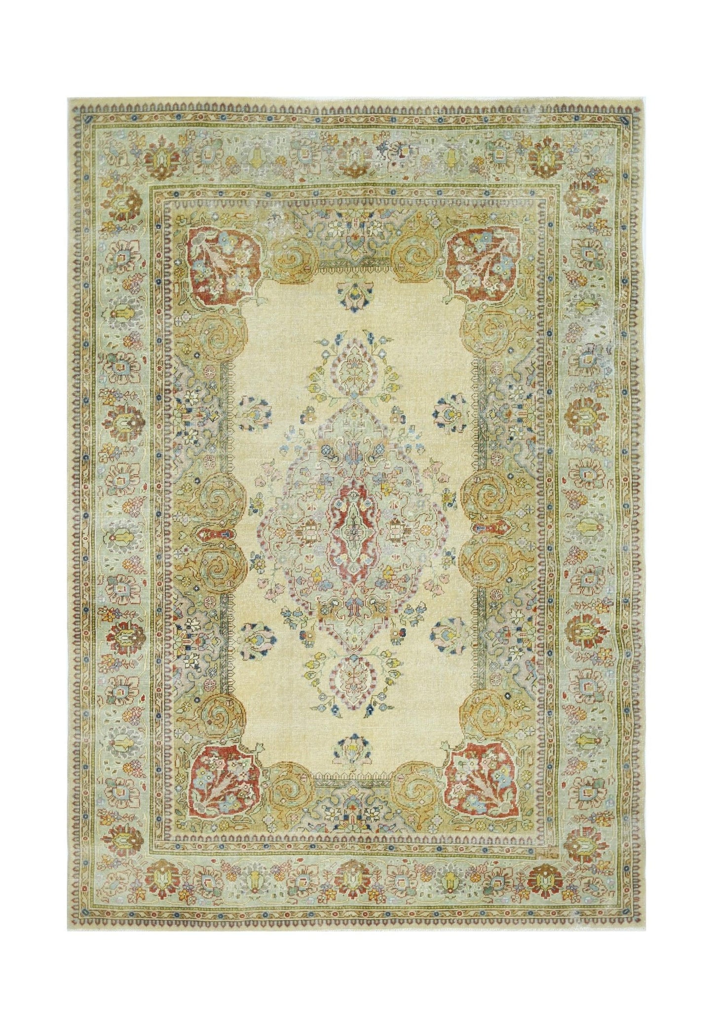 A vintage Persian Tabriz rug featuring a central floral medallion on a cream field with ornate borders.