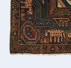 A corner view of a vintage Persian Tabriz rug featuring intricate geometric patterns in wool.