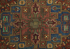A vintage Persian Tabriz rug featuring a geometric medallion pattern in red, blue, and tan tones.