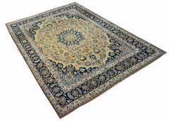 A vintage Persian Kerman rug featuring a central medallion and intricate floral patterns.