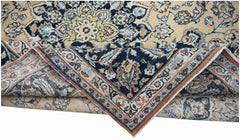 A vintage Persian Kerman rug featuring a central medallion and intricate floral patterns.
