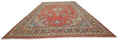 A vintage Persian Tabriz rug featuring a central medallion and floral patterns on a red field.