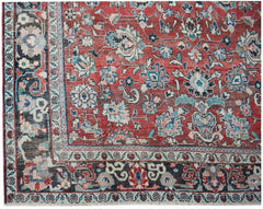 A vintage handwoven Persian Tabriz rug featuring intricate floral patterns in red and blue tones.