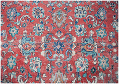 A vintage Persian Tabriz rug featuring intricate floral patterns in red, blue, and cream tones.