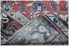 A vintage handwoven Persian Tabriz rug featuring intricate floral patterns in red and blue tones.