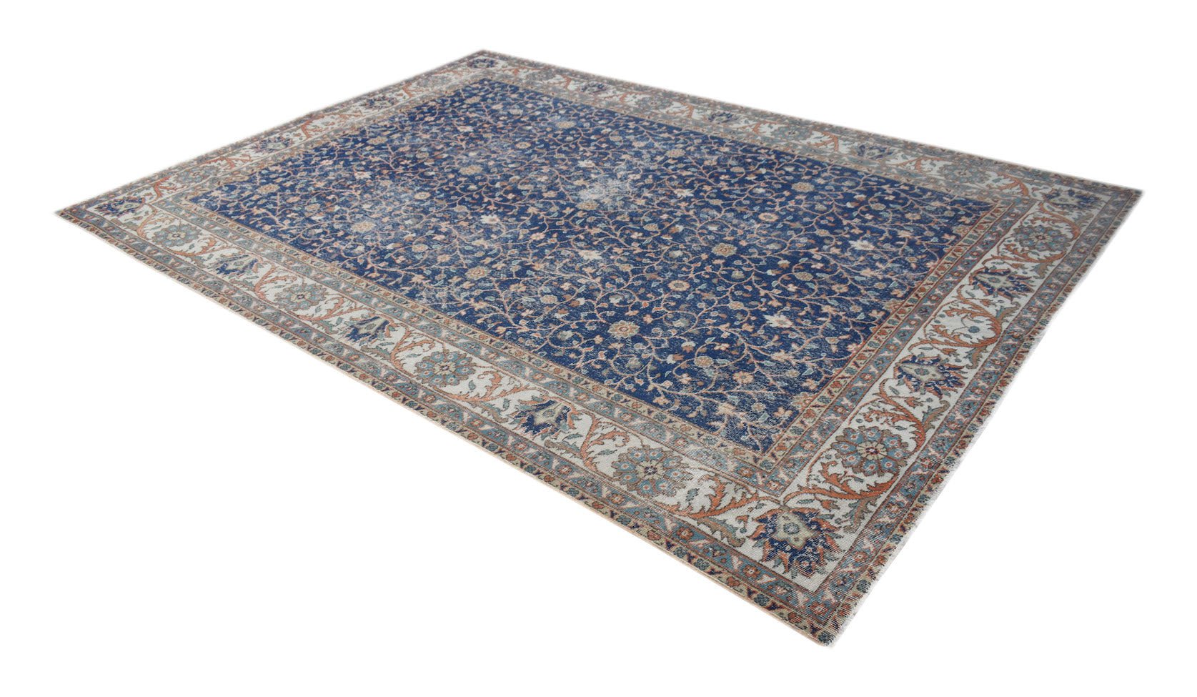 A vintage Persian Tabriz rug featuring a blue field with intricate floral patterns and a wide border.
