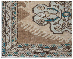 Vintage Persian Tabriz runner with intricate geometric patterns in brown, beige, and teal.