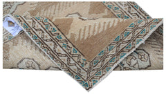 Vintage Persian Tabriz runner with a brown and beige geometric pattern.