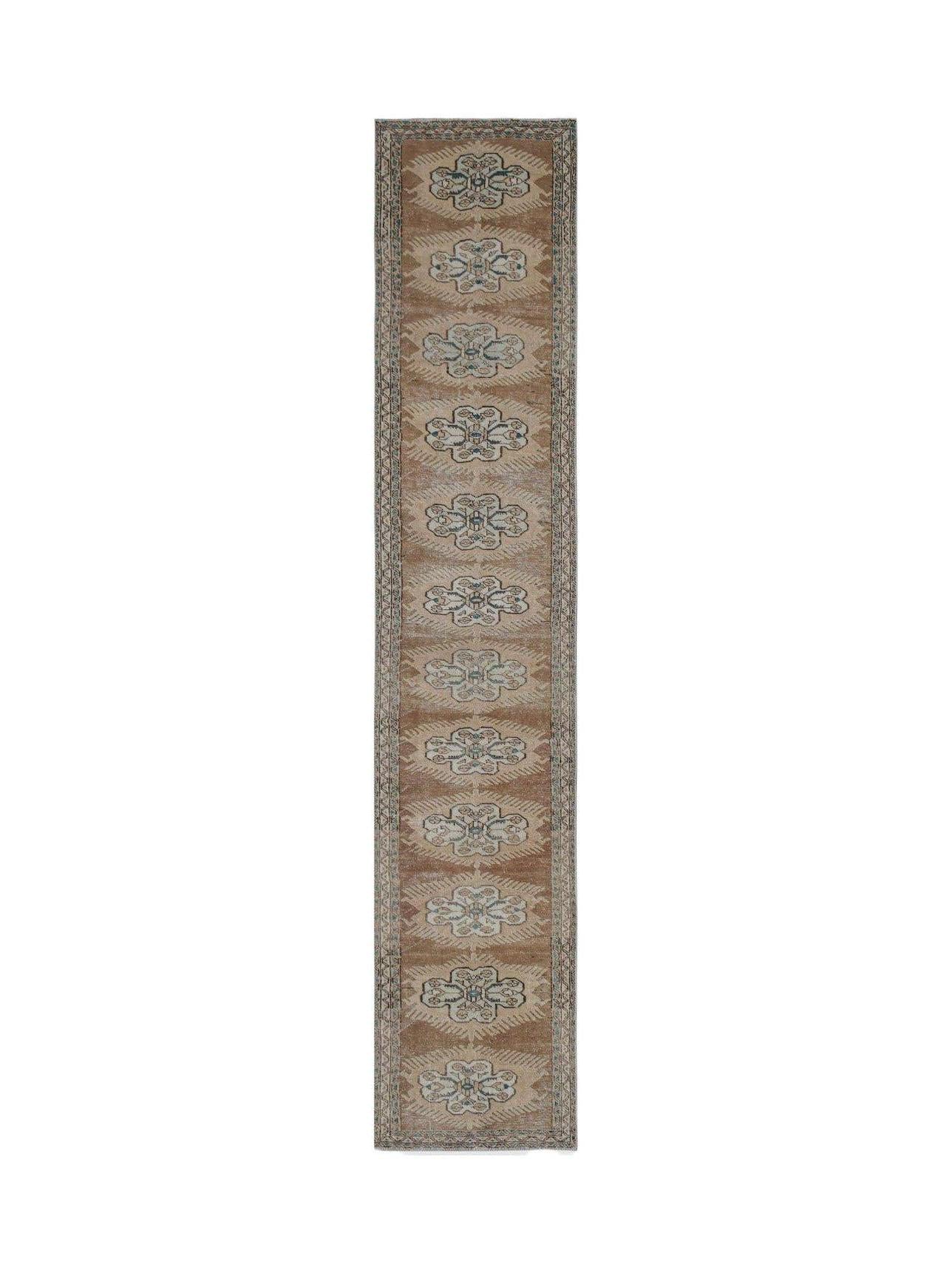 Vintage Persian Tabriz runner with a repeating floral pattern in brown and blue.