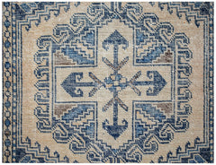 A vintage Persian Wiss rug featuring a blue and beige geometric medallion pattern.