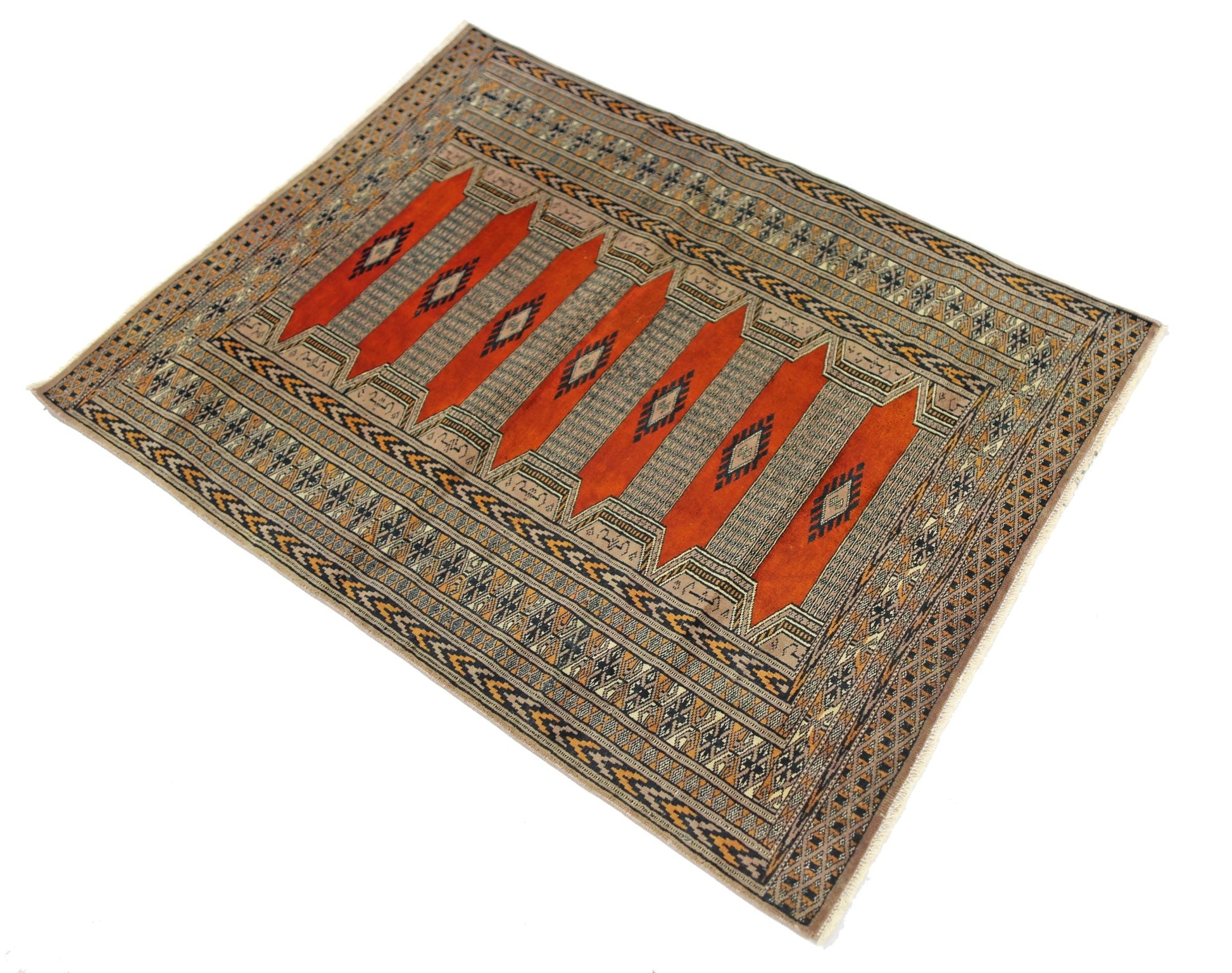 A vintage Pakistani Princess Bokhara rug featuring repeating orange geometric motifs on a wool pile.