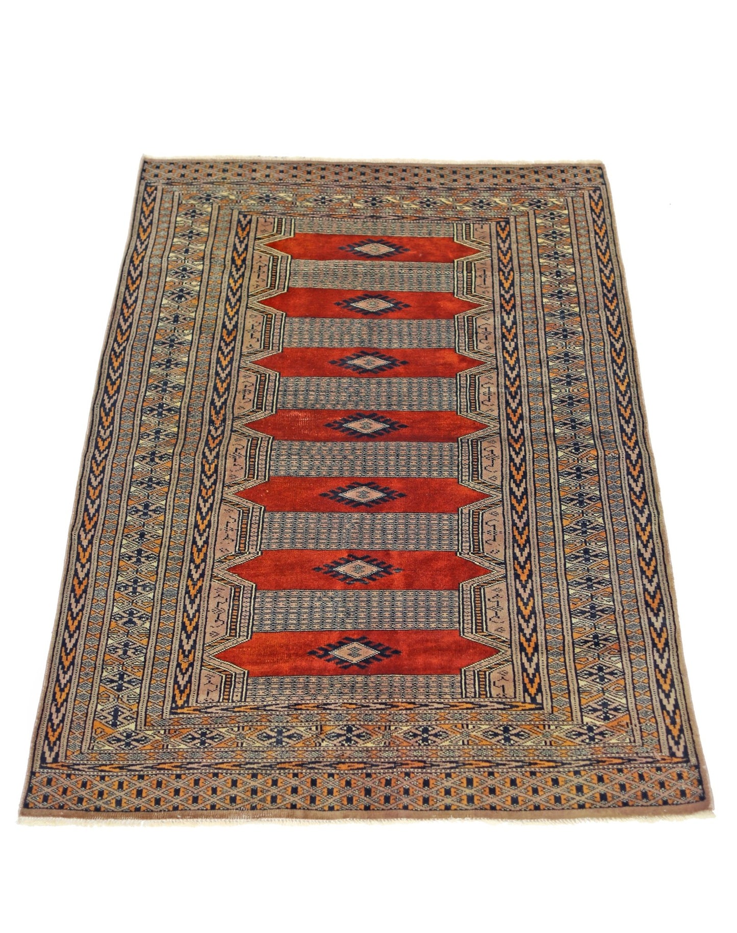 A vintage Pakistani Princess Bokhara rug featuring a repeating red diamond pattern on a wool pile.