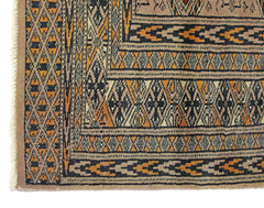 A vintage Pakistani Princess Bokhara rug featuring intricate geometric patterns in orange and black.
