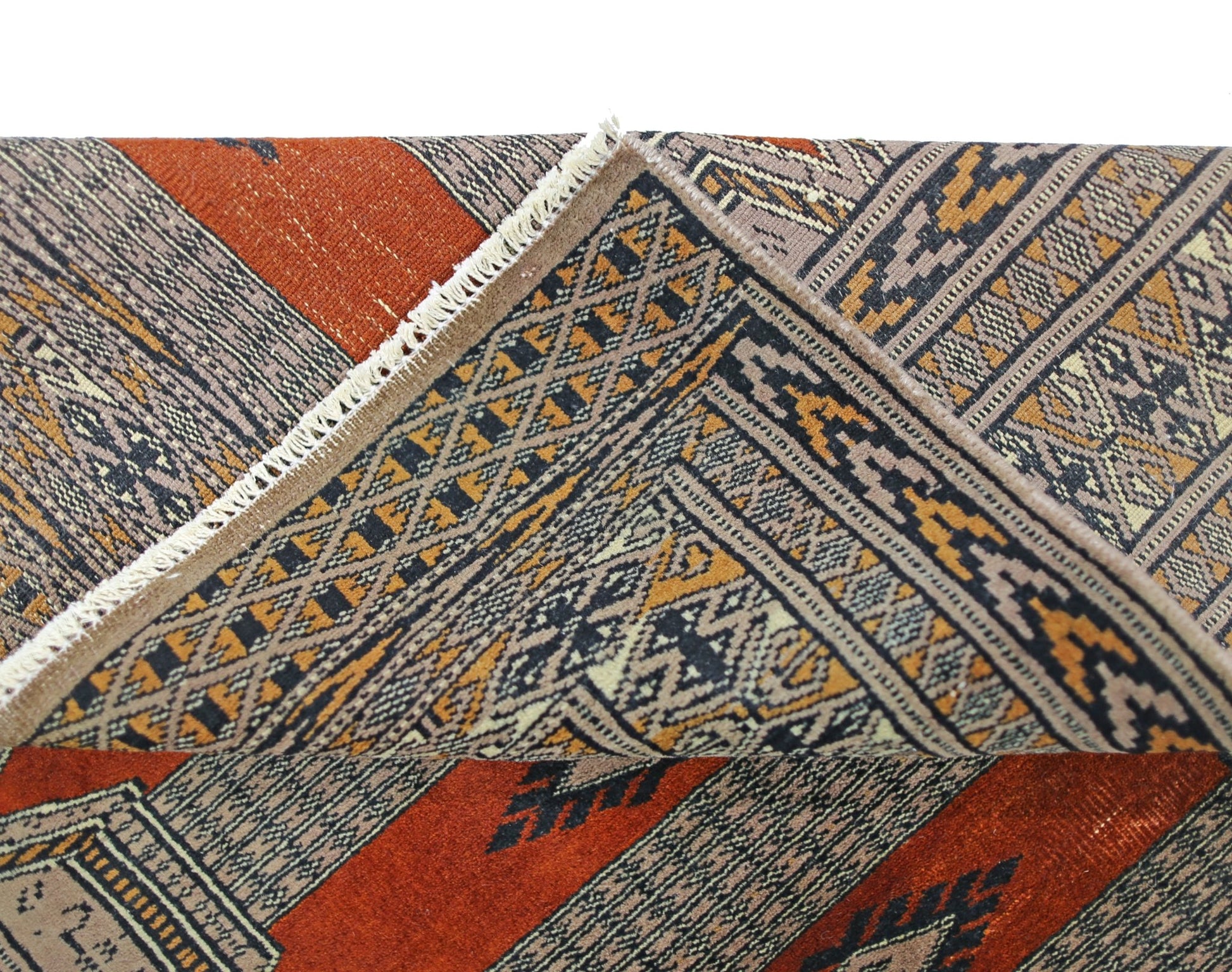A vintage Pakistani Princess Bokhara rug featuring a geometric pattern in rust, black, and tan.
