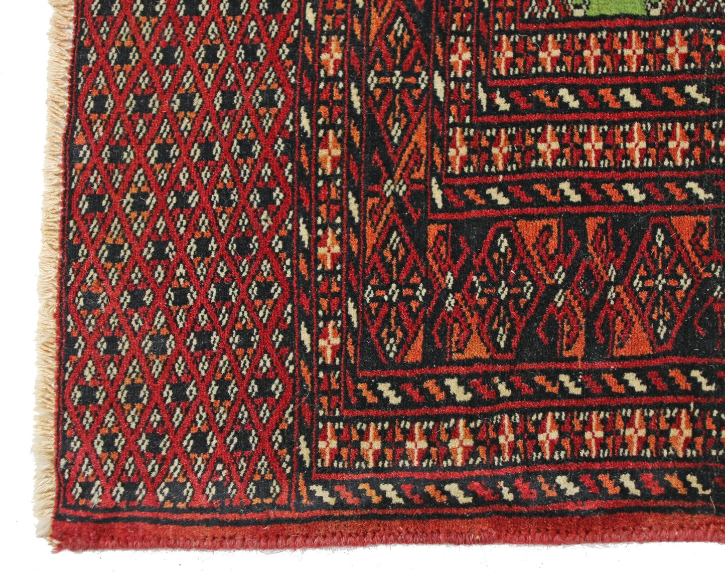 A vintage Pakistani Princess Bokhara rug featuring a geometric diamond pattern in red and black.