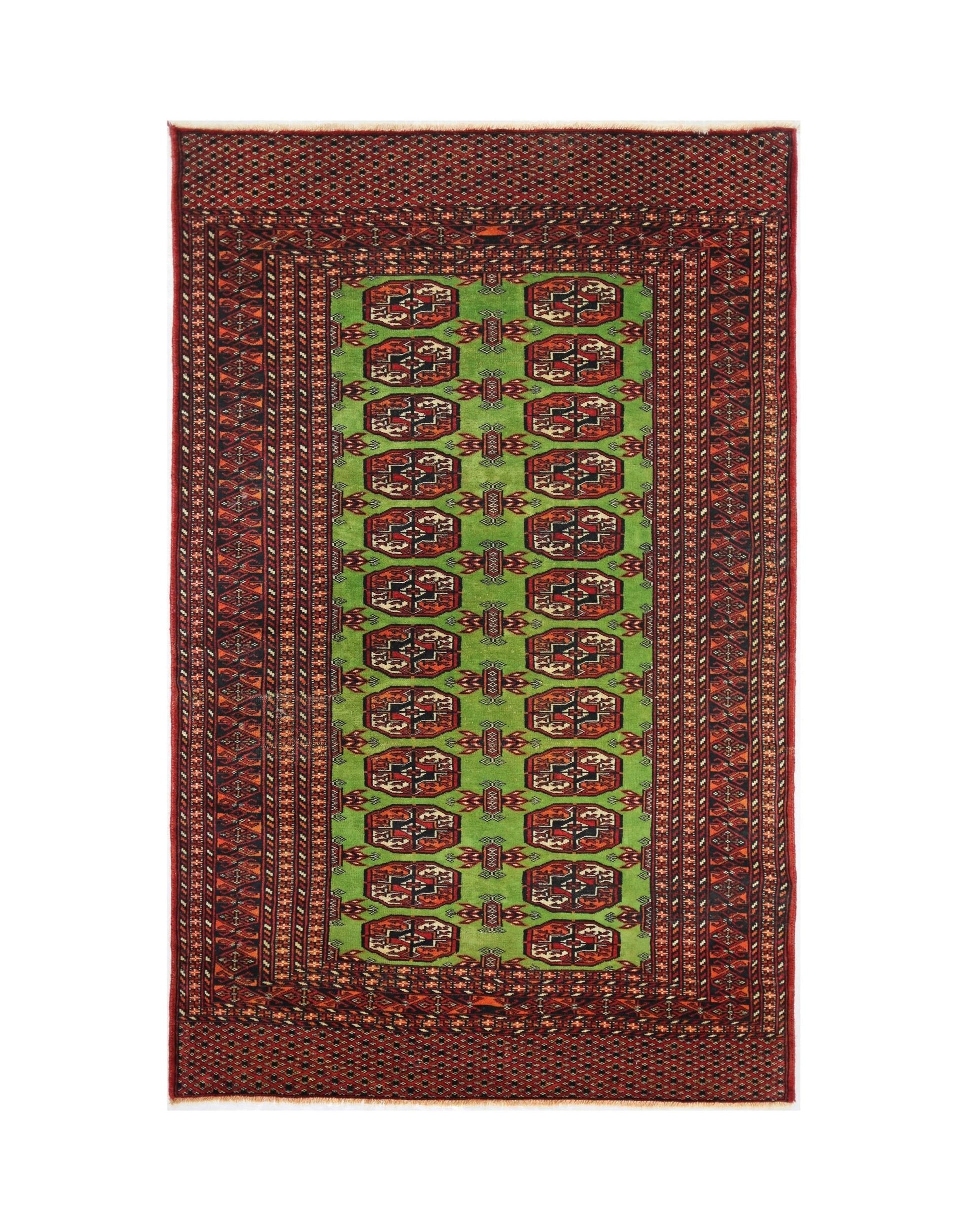 A vintage Pakistani Princess Bokhara rug featuring a bright green field with repeating red motifs.