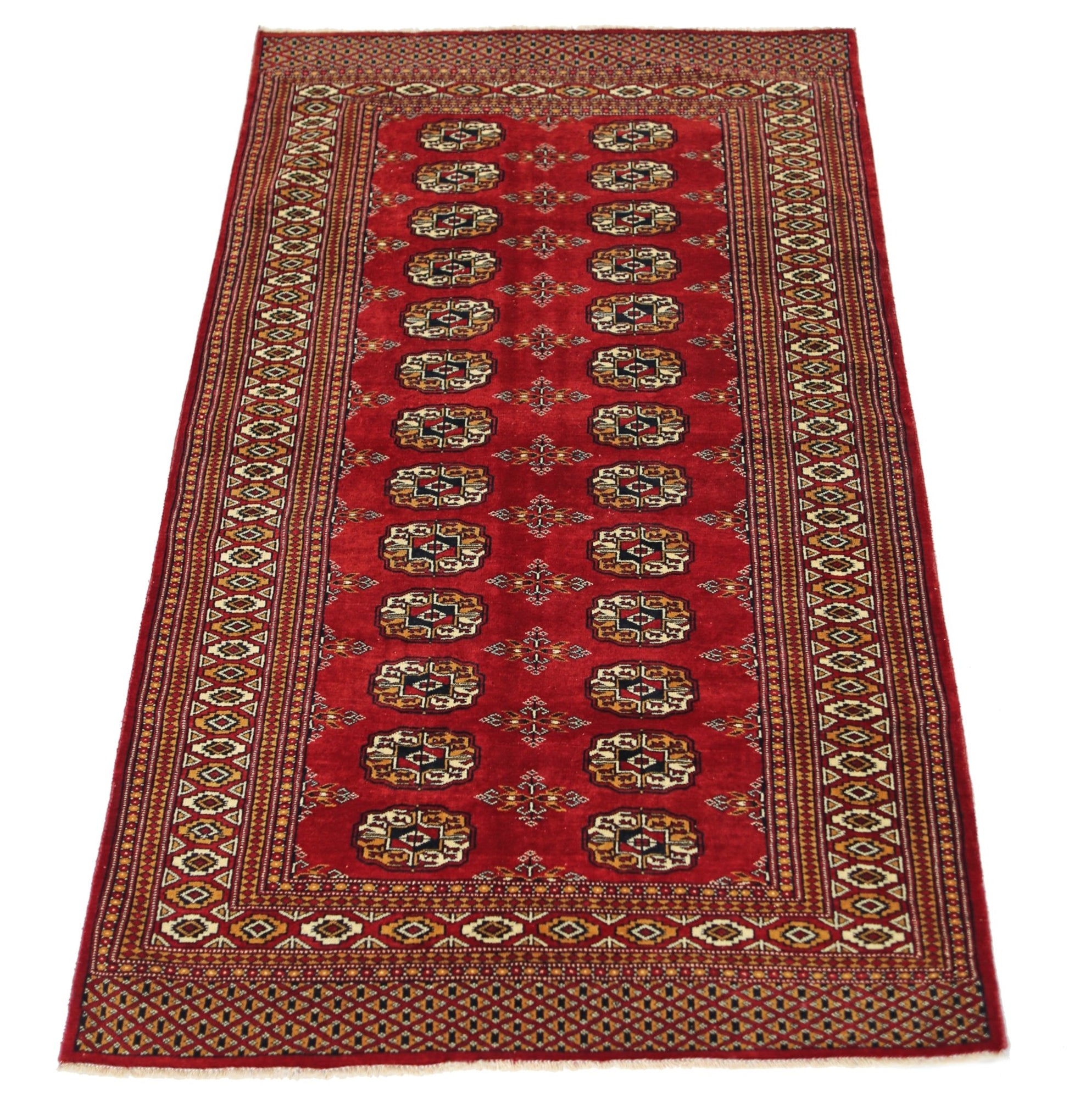 A vintage Pakistani Princess Bokhara rug featuring a red field with repeating geometric motifs.