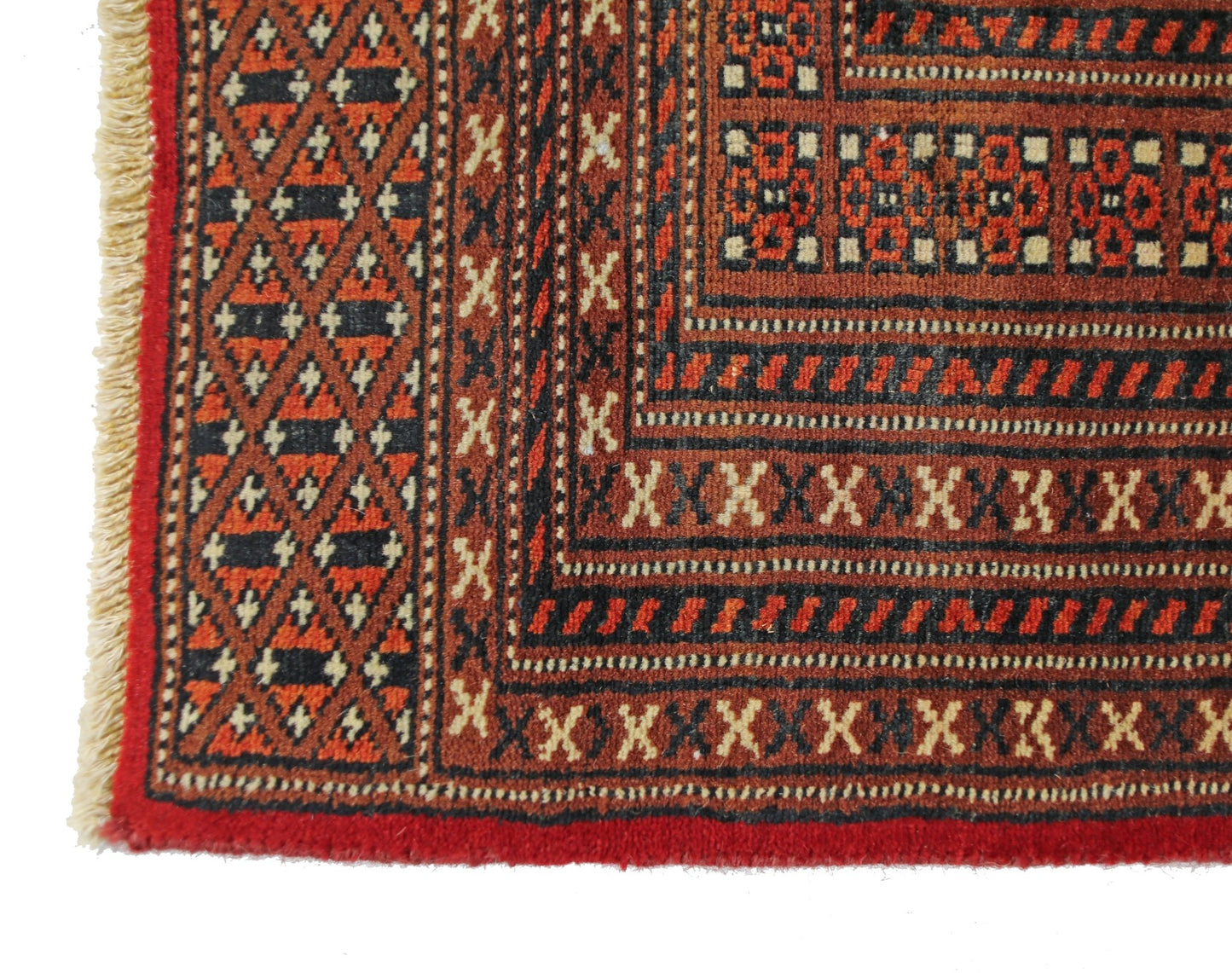 A vintage Pakistani Princess Bokhara rug featuring a geometric pattern in red and black wool.