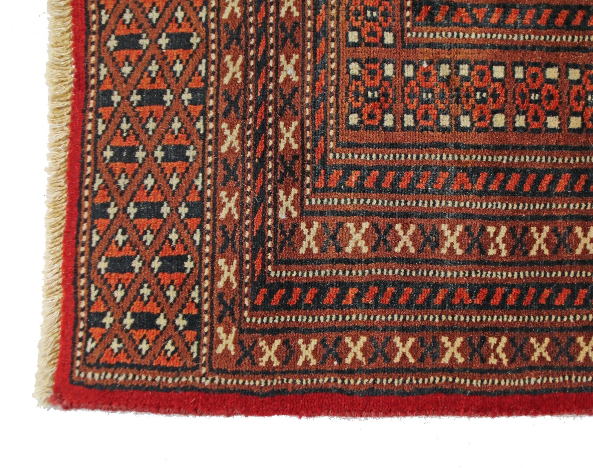 A vintage Pakistani Princess Bokhara rug featuring a geometric pattern in red and black wool.