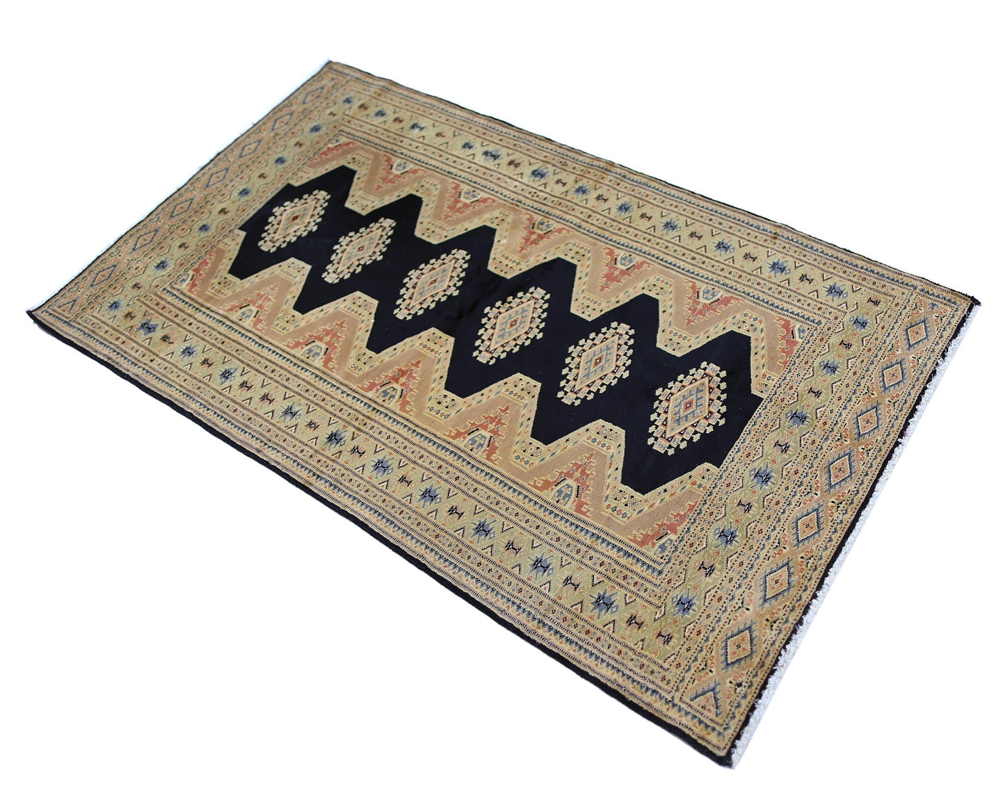 Vintage Pakistani Princess Bokhara rug featuring a dark central zigzag pattern on a tan background.