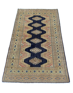 A vintage Pakistani Princess Bokhara rug featuring a dark blue central medallion on a tan field.
