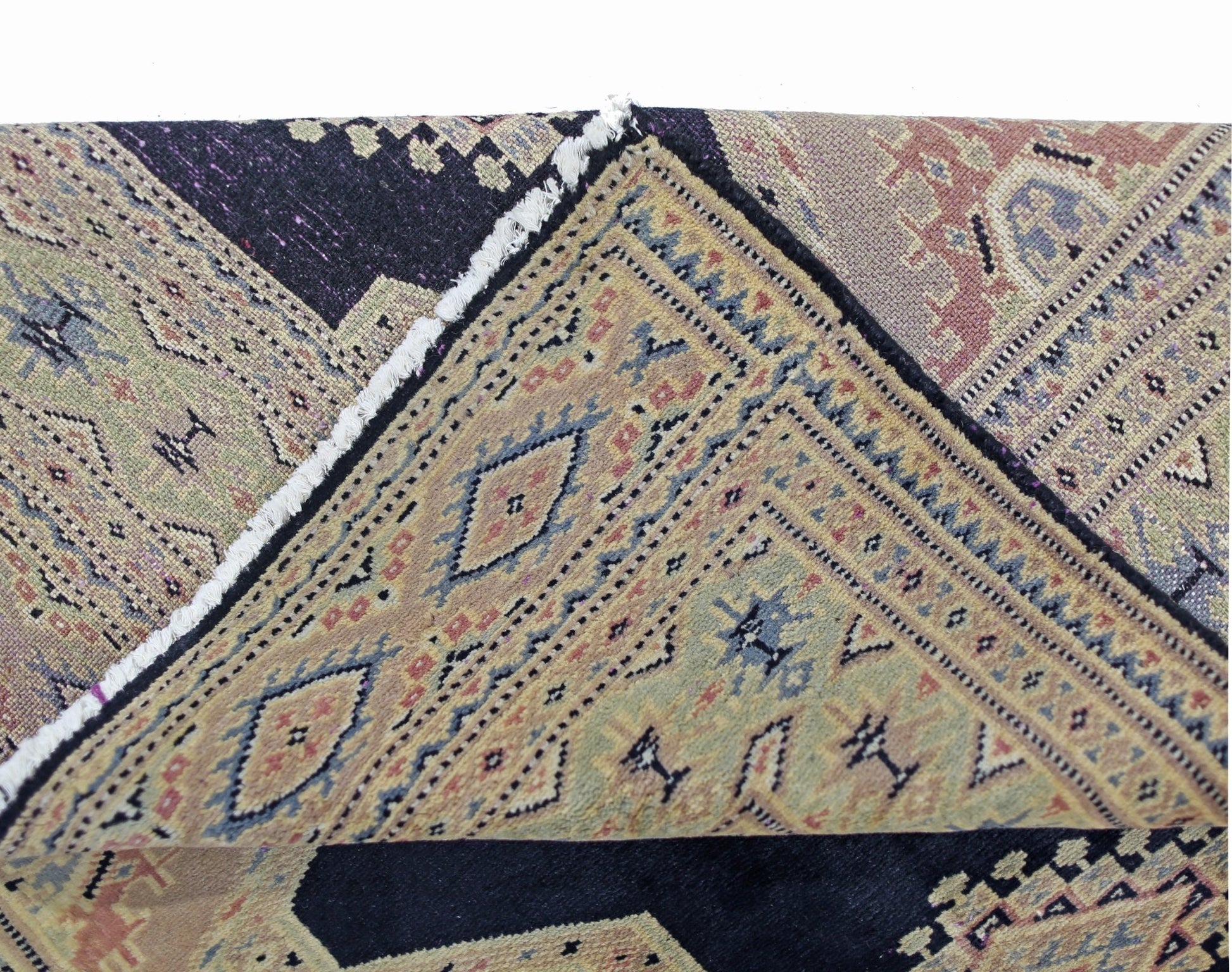 A vintage Pakistani Princess Bokhara rug with intricate geometric patterns in wool on cotton.