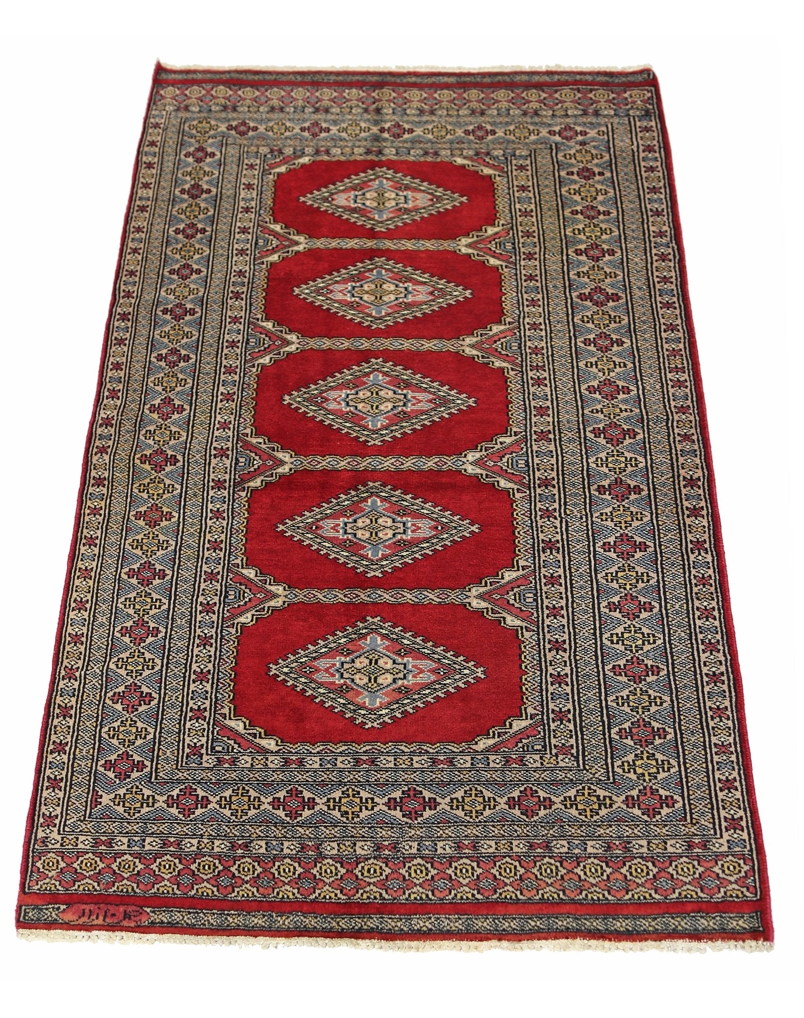 A vintage Pakistani Princess Bokhara rug featuring five diamond medallions on a vibrant red field.