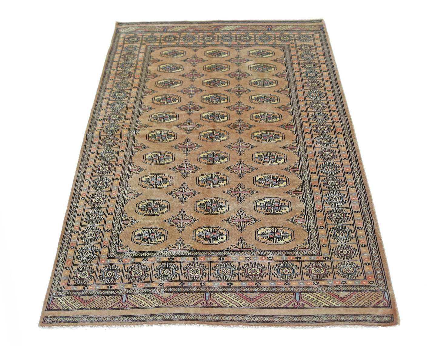 A vintage Pakistani Princess Bokhara rug featuring a repeating geometric pattern on a tan field.