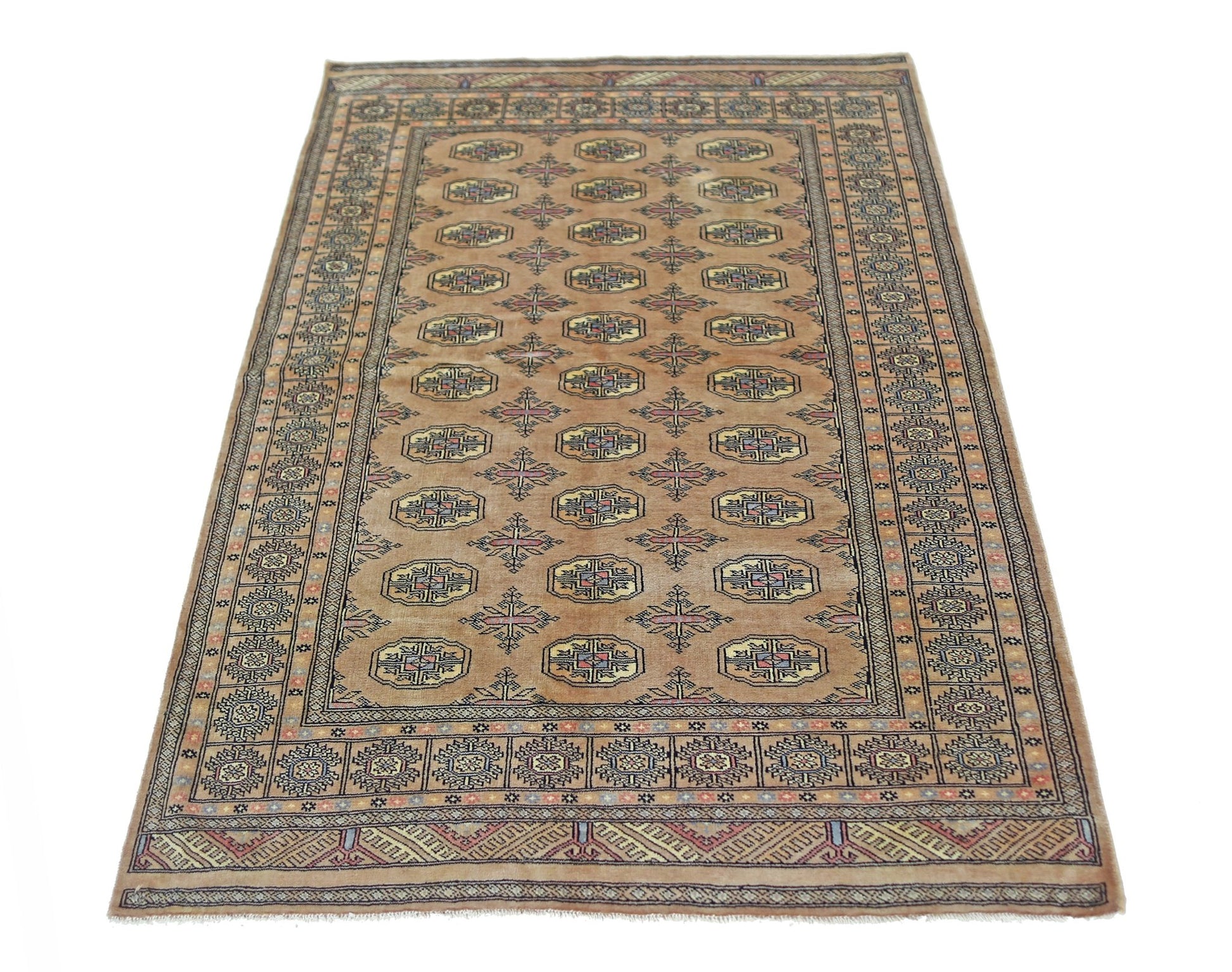 A vintage Pakistani Princess Bokhara rug featuring a repeating geometric pattern on a tan field.