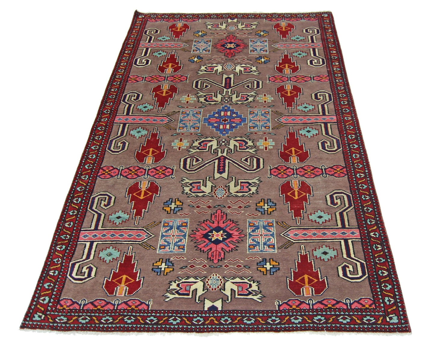 A vintage Pakistani Princess Bokhara rug featuring geometric patterns in red, blue, and pink.