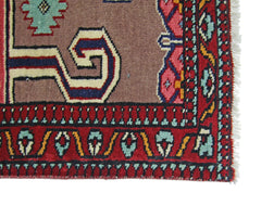 A vintage Pakistani Princess Bokhara rug featuring a geometric pattern in red, brown, and blue.