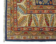 A vintage Pakistani Princess Bokhara rug featuring intricate geometric patterns in vibrant colors.