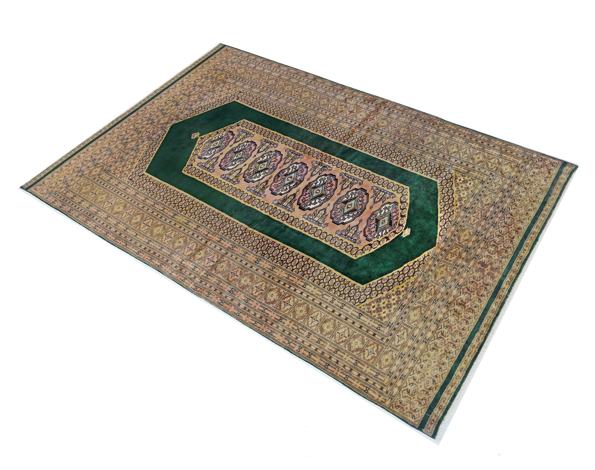 A vintage Pakistani Princess Bokhara rug featuring a green central field with geometric patterns.