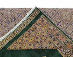 A vintage Pakistani Princess Bokhara rug featuring a geometric pattern in pink, yellow, and blue.