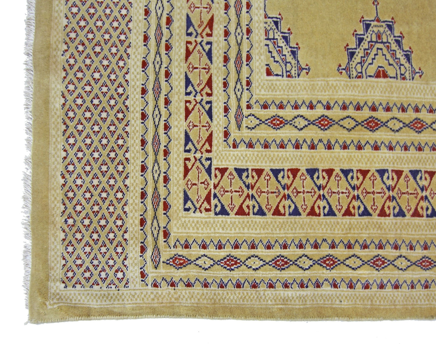 A vintage Pakistani Princess Bokhara rug featuring a geometric pattern in red, blue, and tan.