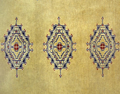 A vintage Pakistani Princess Bokhara rug featuring three repeating geometric medallions on a tan base.