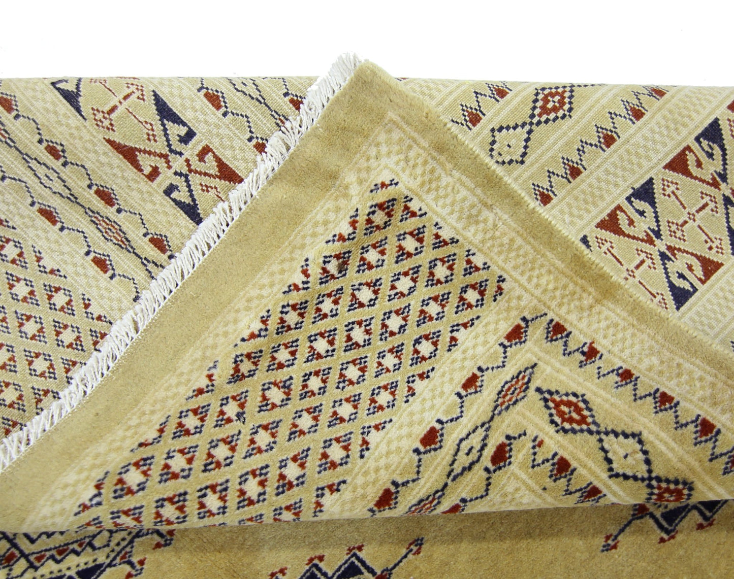 A vintage Pakistani Princess Bokhara rug featuring a geometric diamond pattern in tan and red.