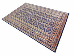 A vintage Pakistani Princess Bokhara rug featuring a blue field with repeating geometric motifs.