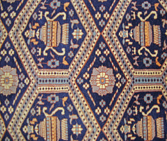 Vintage Pakistani Princess Bokhara rug featuring a repeating diamond pattern in blue and gold.