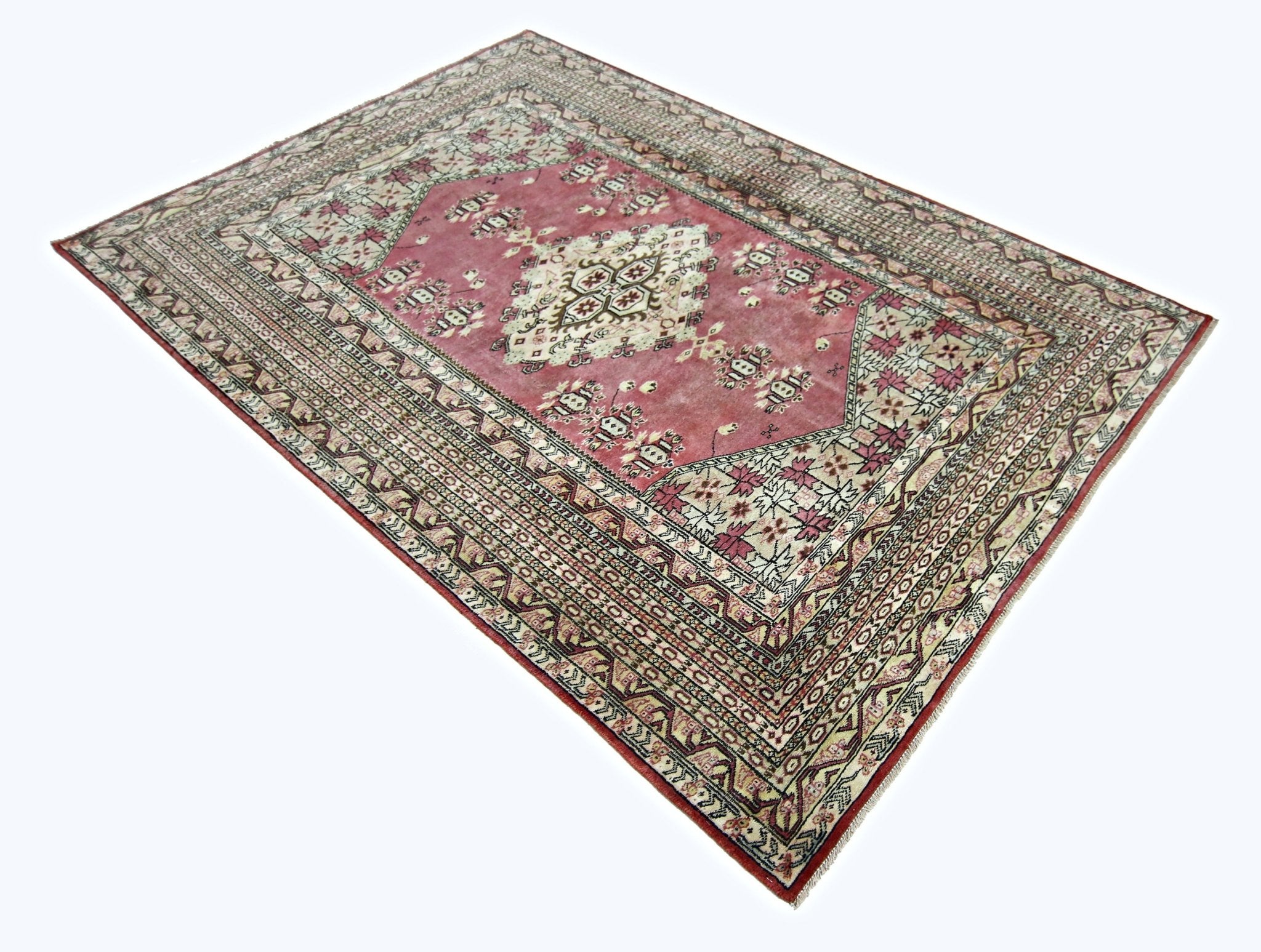 A vintage Pakistani Princess Bokhara rug featuring a pink field with intricate geometric patterns.