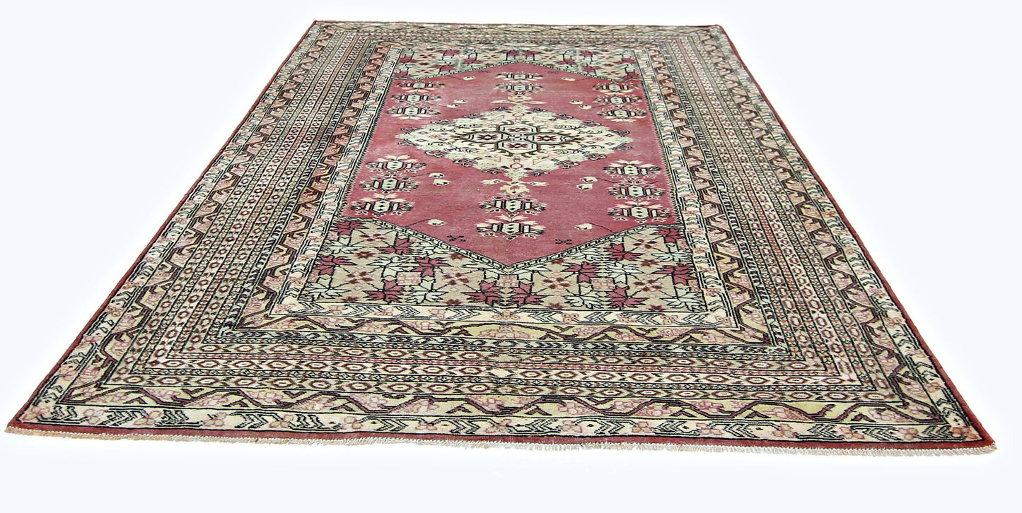 A vintage Pakistani Princess Bokhara rug featuring a geometric pattern in red and cream tones.