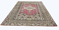 A vintage Pakistani Princess Bokhara rug featuring a geometric pattern in red and cream tones.