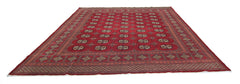 A vintage Pakistani Princess Bokhara rug featuring a deep red field with repeating geometric motifs.