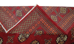 A vintage Pakistani Princess Bokhara rug featuring a deep red field with traditional geometric motifs.